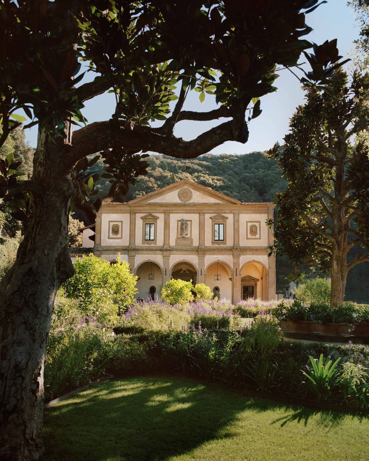 The loggia façade of Villa San Michele behind its garden of lavender and magnolia, on the Fiesole hillside